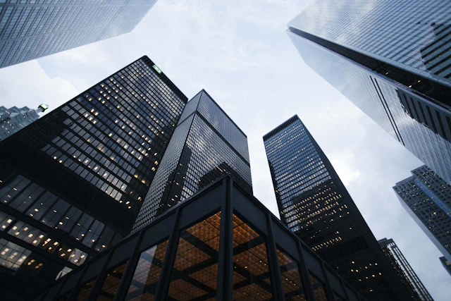 Glass office towers seen from street level