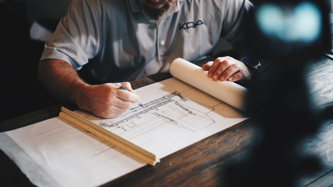 Architect drawing on a blueprint